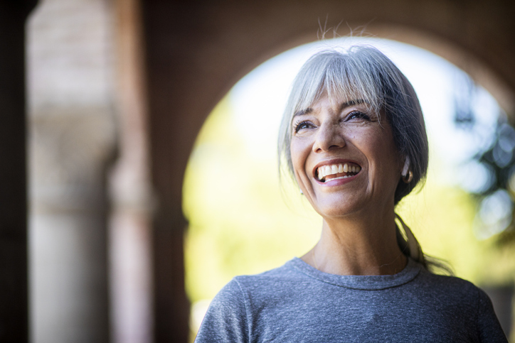 A senior woman working out in the city